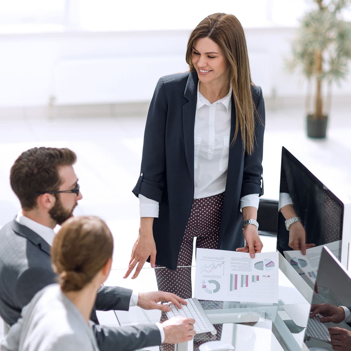 Office workers collaborating on records management.